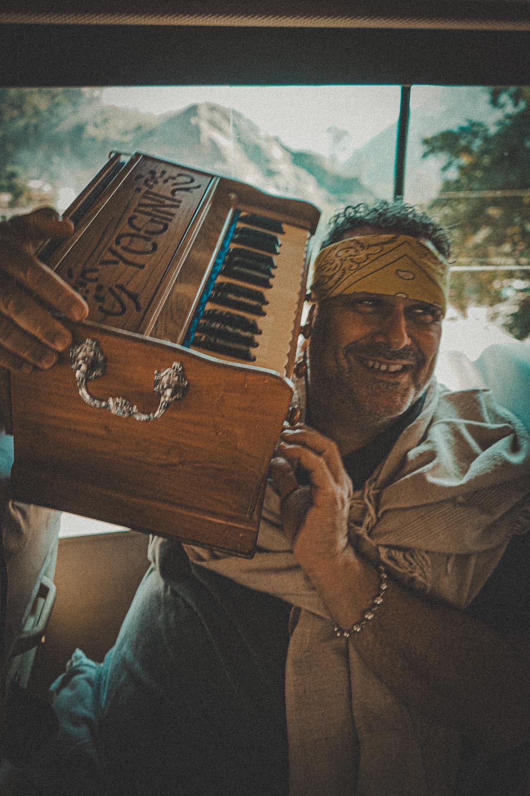 Gaura Vani with his harmonium on the bus